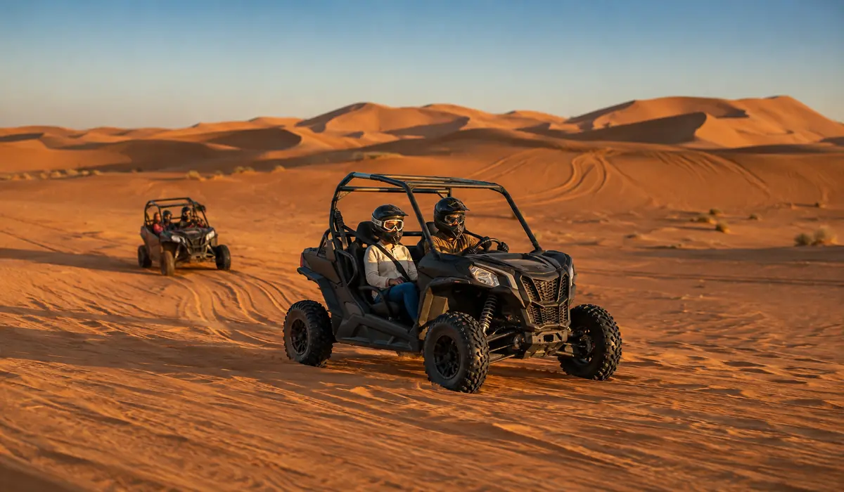 Travelers enjoying a guided desert buggy tour across the Erg Chebbi dunes near Merzouga